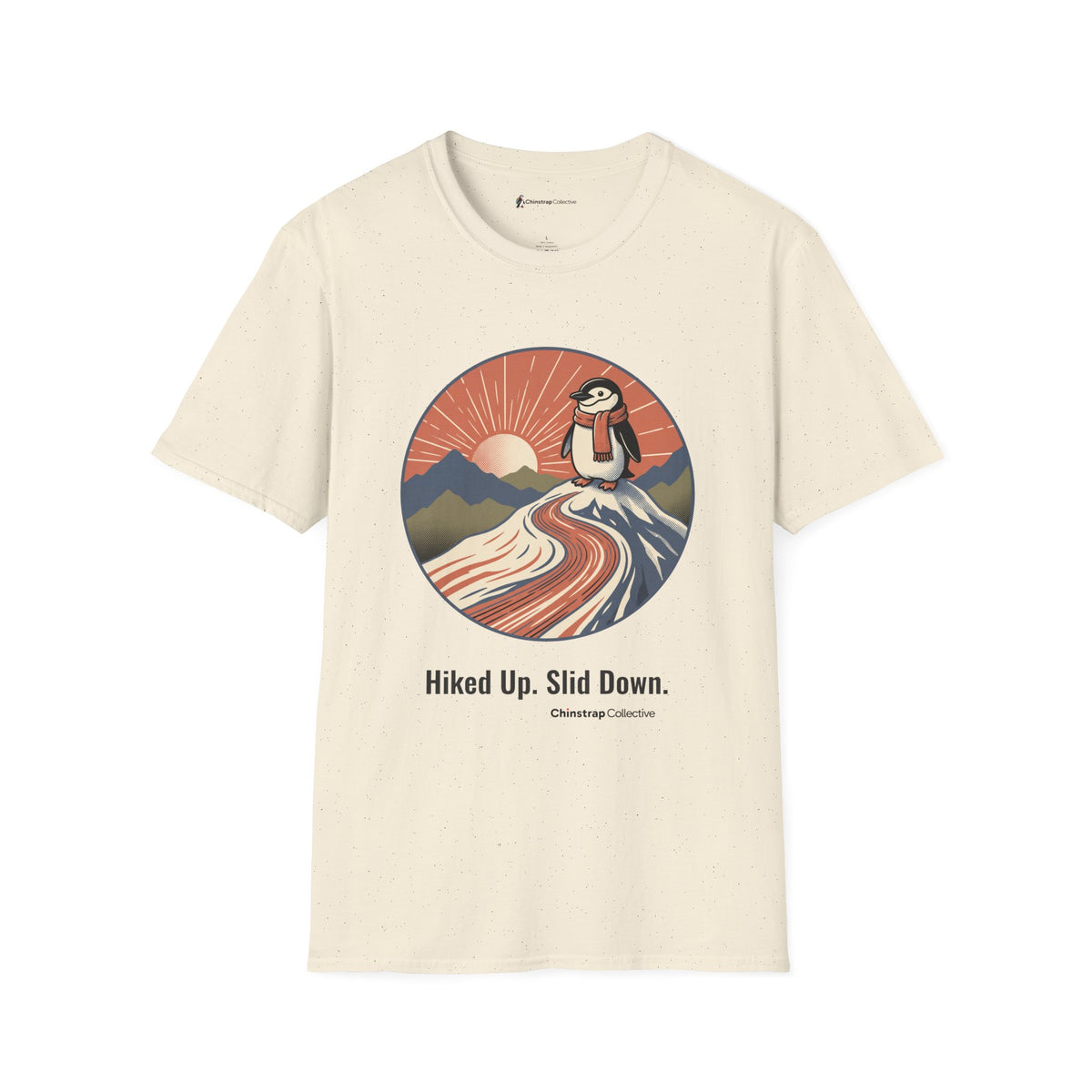 Hiked Up penguin T-shirt in Natural: Under a rising sun with fanned rays, the penguin in an orange scarf stands