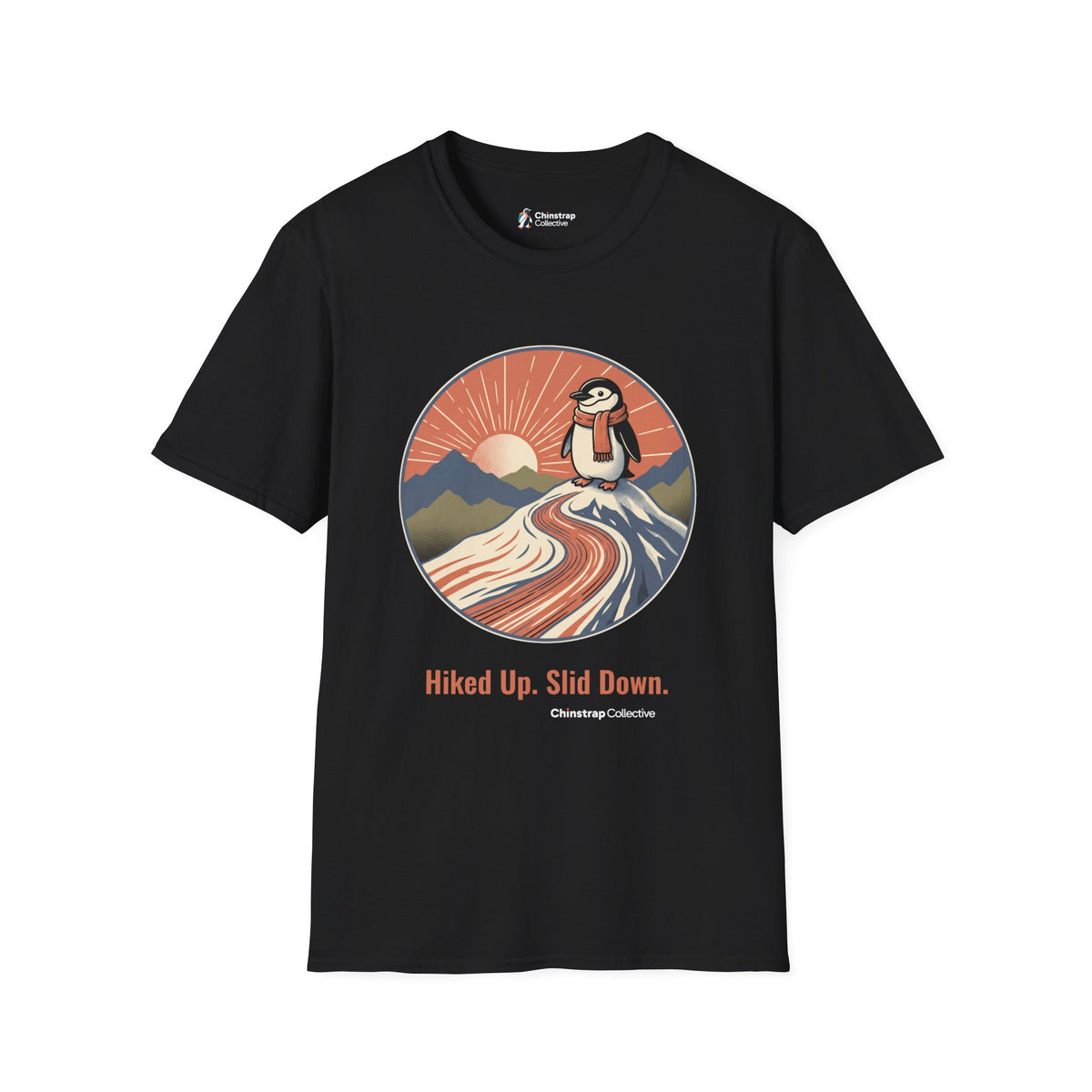 Hiked Up penguin T-shirt in Black: Under a rising sun with fanned rays, the penguin in an orange scarf stands