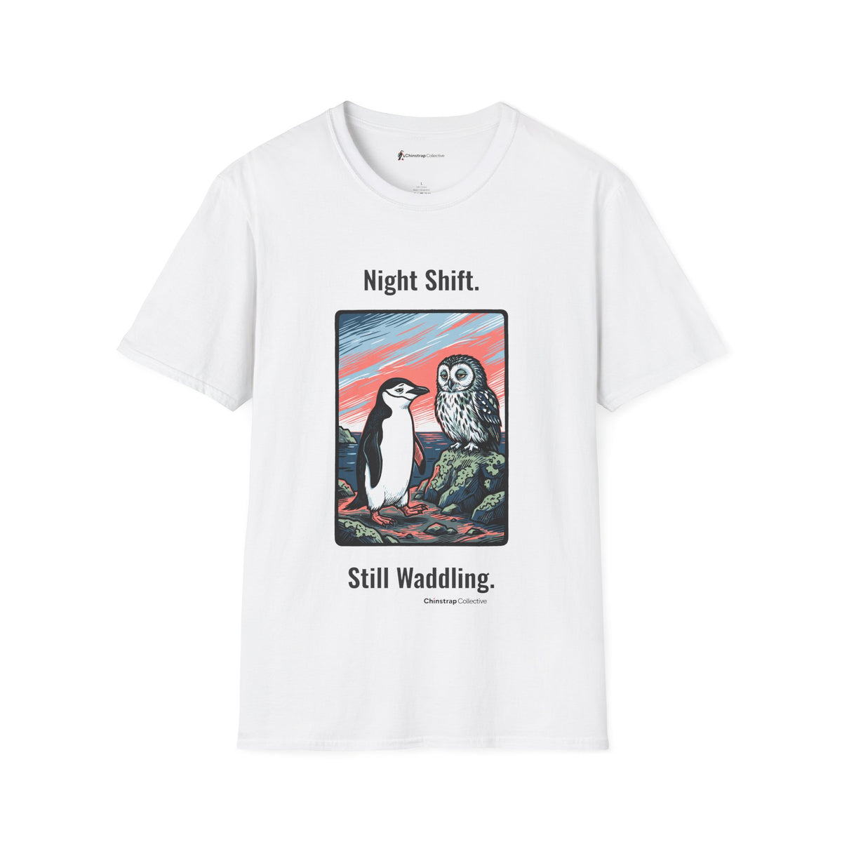 Still Waddling penguin T-shirt in White: The art shows the chinstrap penguin on the rocky shore at dawn, trading a tired…