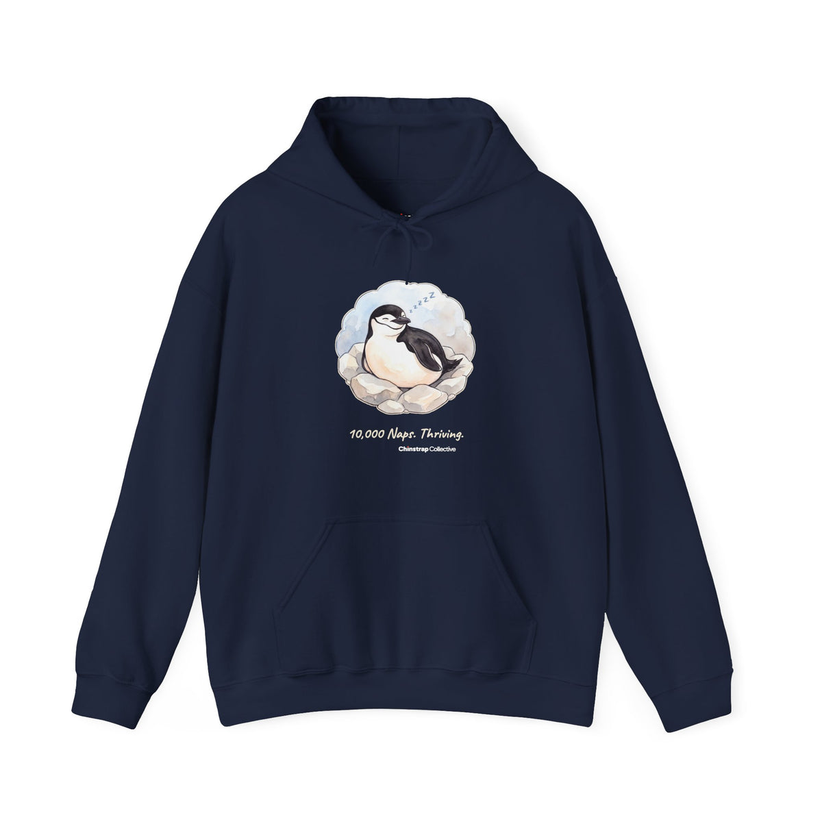 Professional Napper penguin hoodie in Navy: On its rocky nest the chinstrap penguin nods off mid-blink, with a trail of…