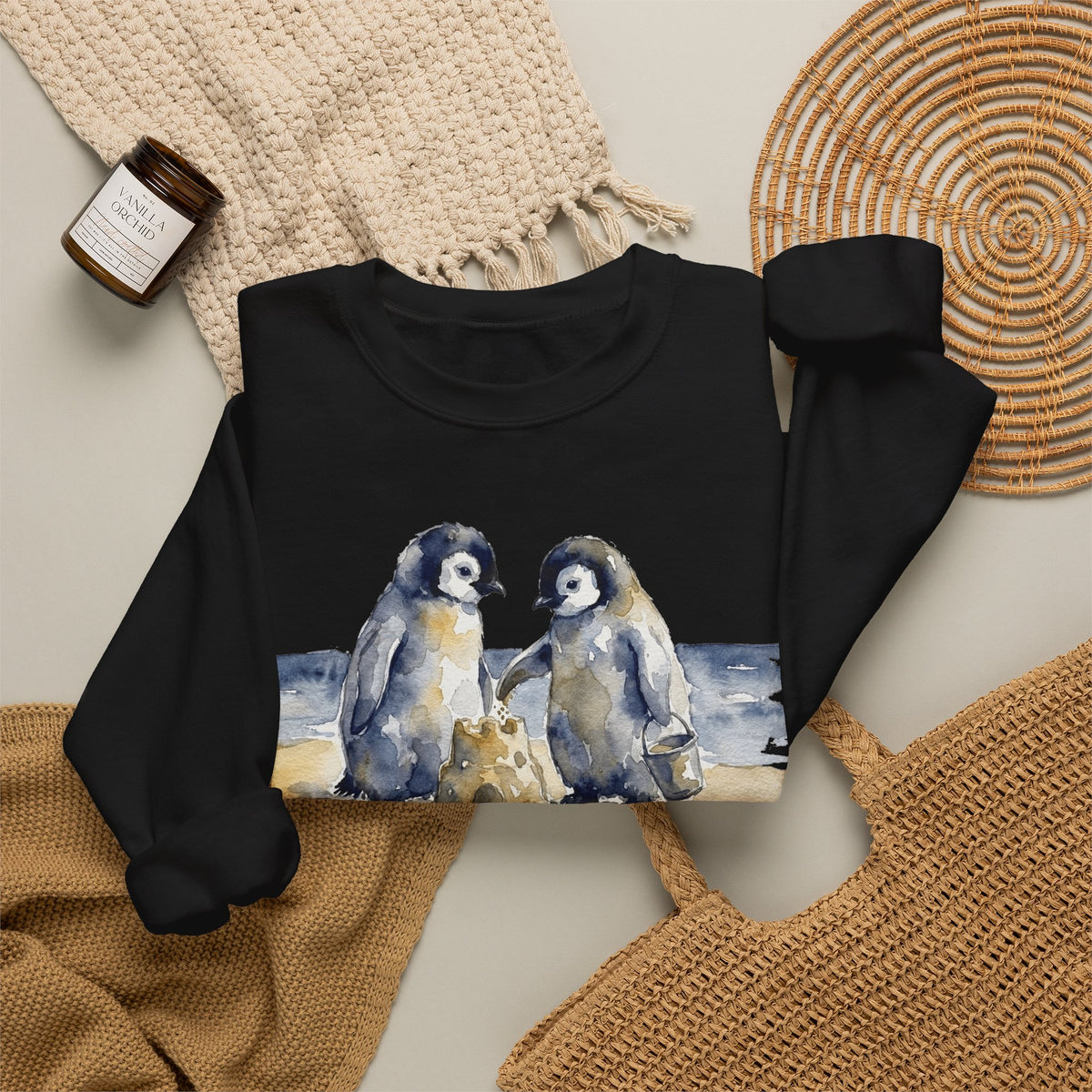 The Sandcastle Penguin Chicks sweatshirt in Black, folded