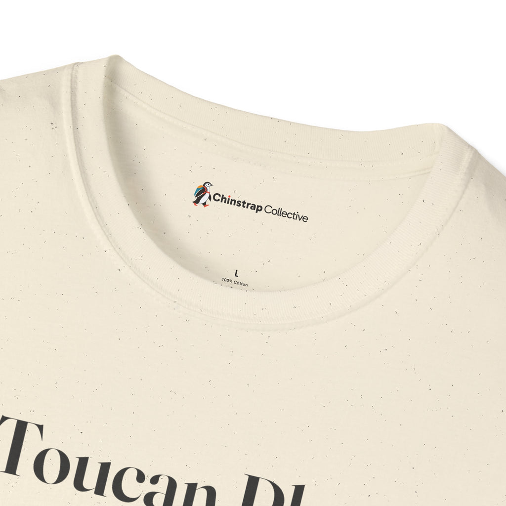 The Chinstrap Collective neck label on the Toucan Play That Game T-shirt in Natural