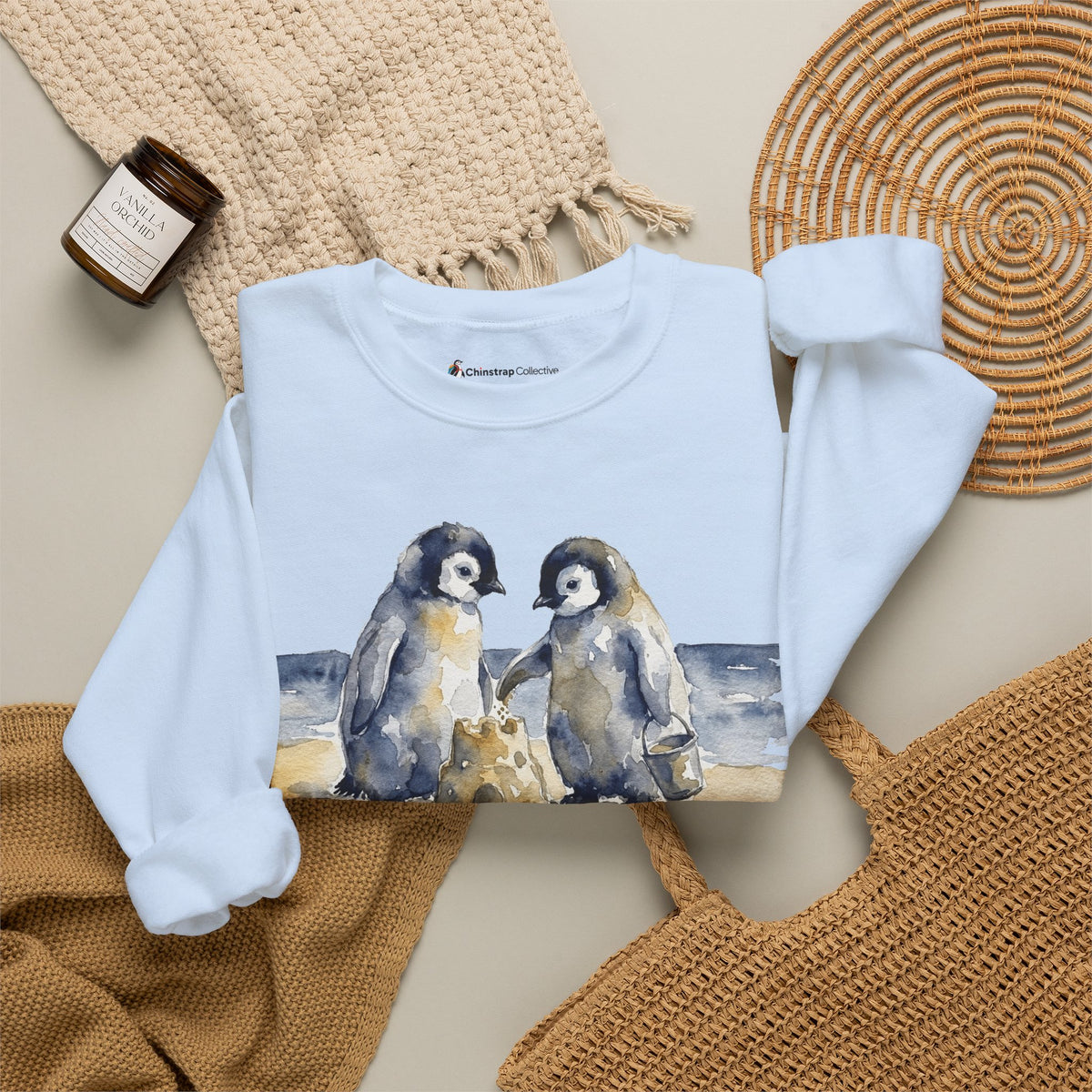 The Sandcastle Penguin Chicks sweatshirt in Light Blue, folded