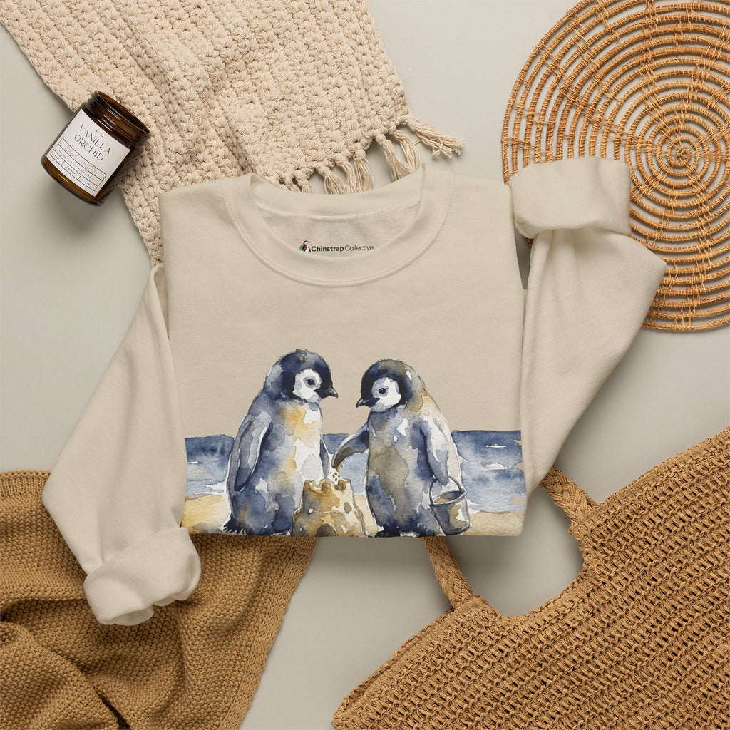 The Sandcastle Penguin Chicks sweatshirt in Sand, folded