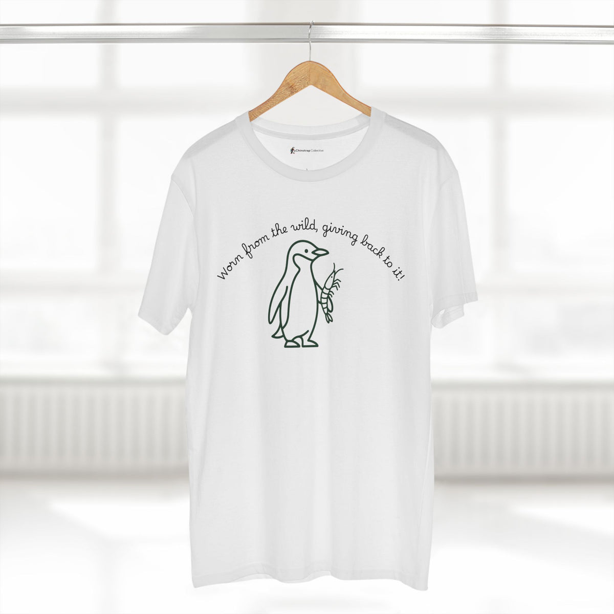The Penguin and Krill T-shirt in White, worn outdoors