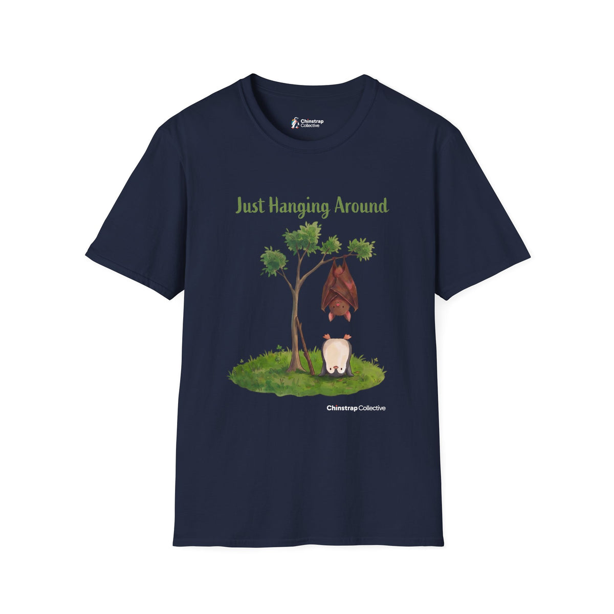 Just Hanging Around penguin T-shirt in Navy: A brown bat hangs upside down from a leafy tree while, on the grass below,…