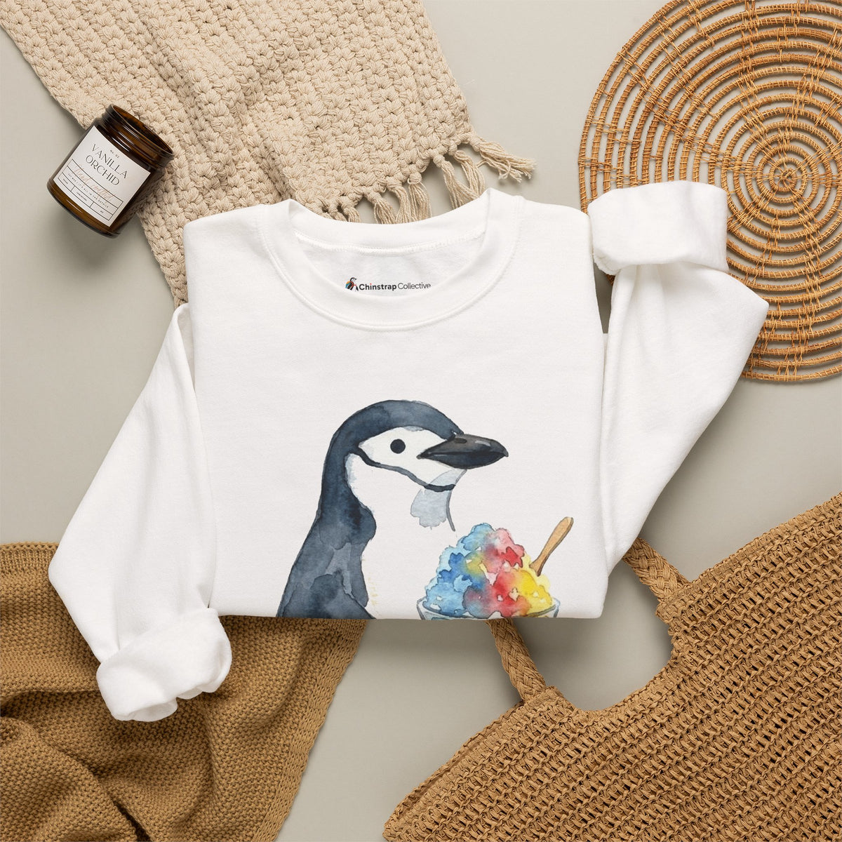 The Chinstrap Shaved Ice sweatshirt in White, folded