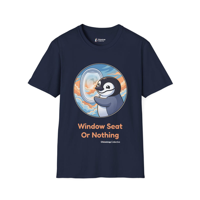 Window Seat penguin T-shirt in Navy: A cartoon chinstrap penguin beside a round airplane window full of peach and blue…