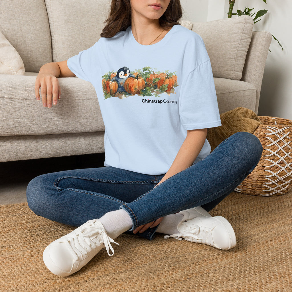 The Penguin Pumpkin Patch T-shirt in Light Blue, worn outdoors