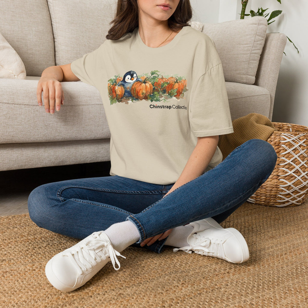 The Penguin Pumpkin Patch T-shirt in Sand, worn outdoors