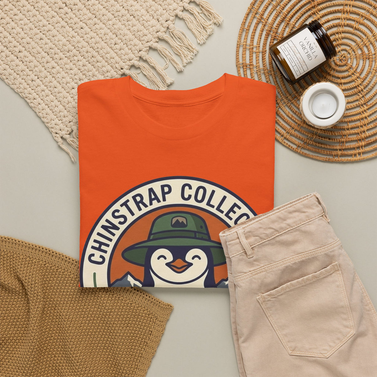 The Penguin Patch T-shirt in Orange, folded