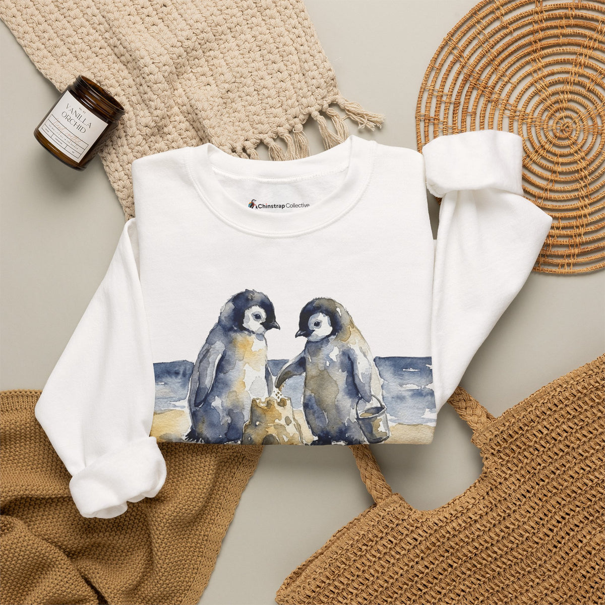 The Sandcastle Penguin Chicks sweatshirt in White, folded
