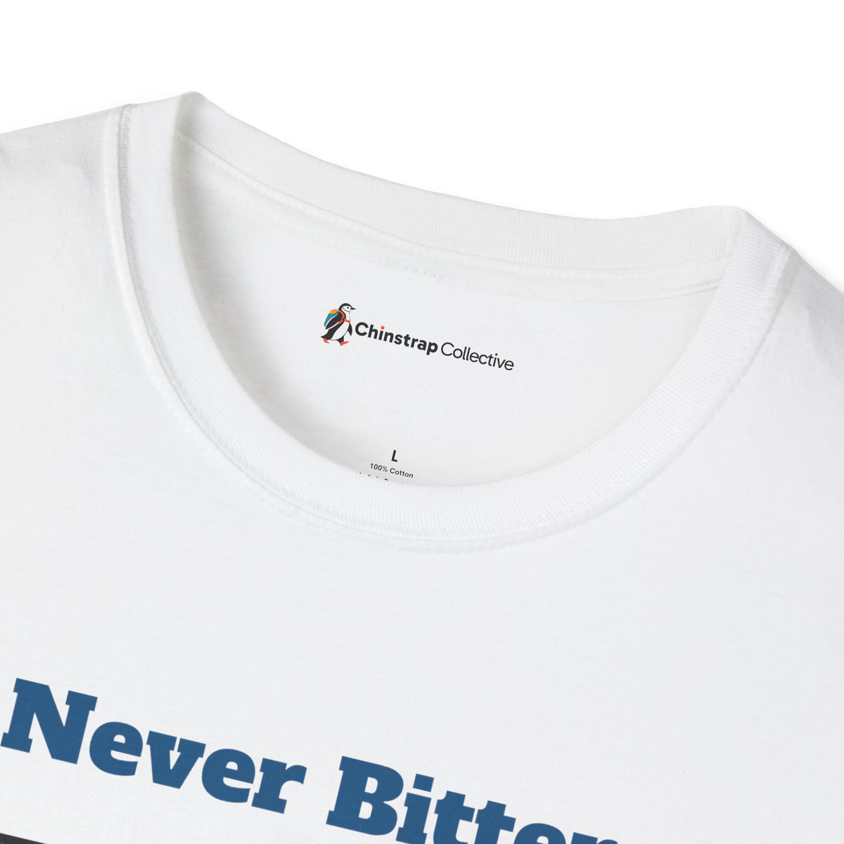 The Chinstrap Collective neck label on the Never Bitter T-shirt in White
