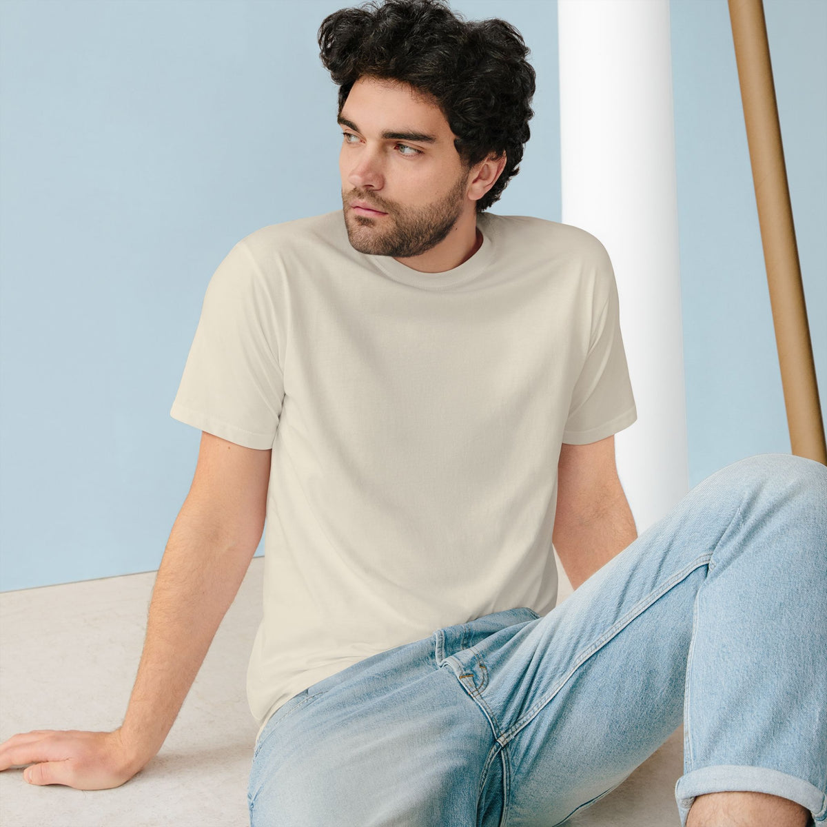 The Penguin Mountain River T-shirt in Natural, worn outdoors