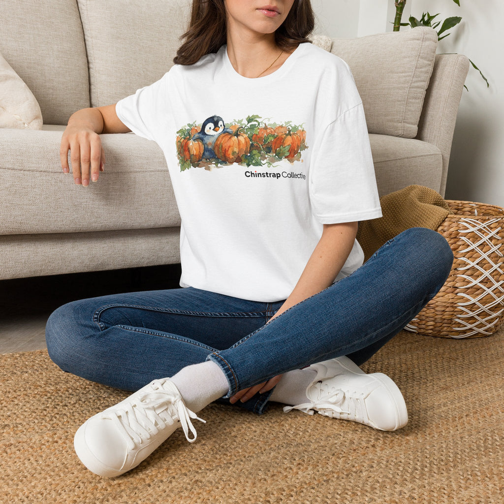 The Penguin Pumpkin Patch T-shirt in White, worn outdoors