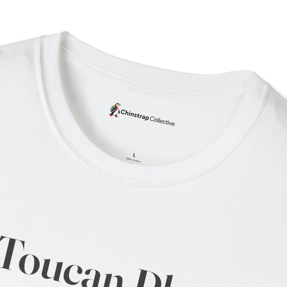 The Chinstrap Collective neck label on the Toucan Play That Game T-shirt in White