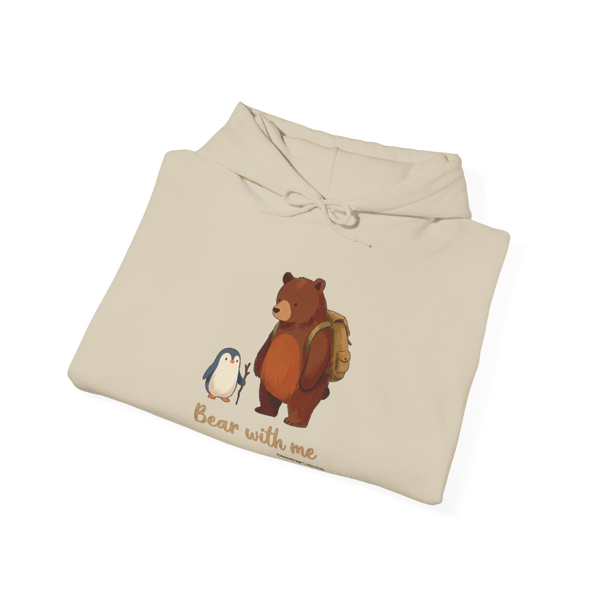 The Bear With Me hoodie in Sand, folded