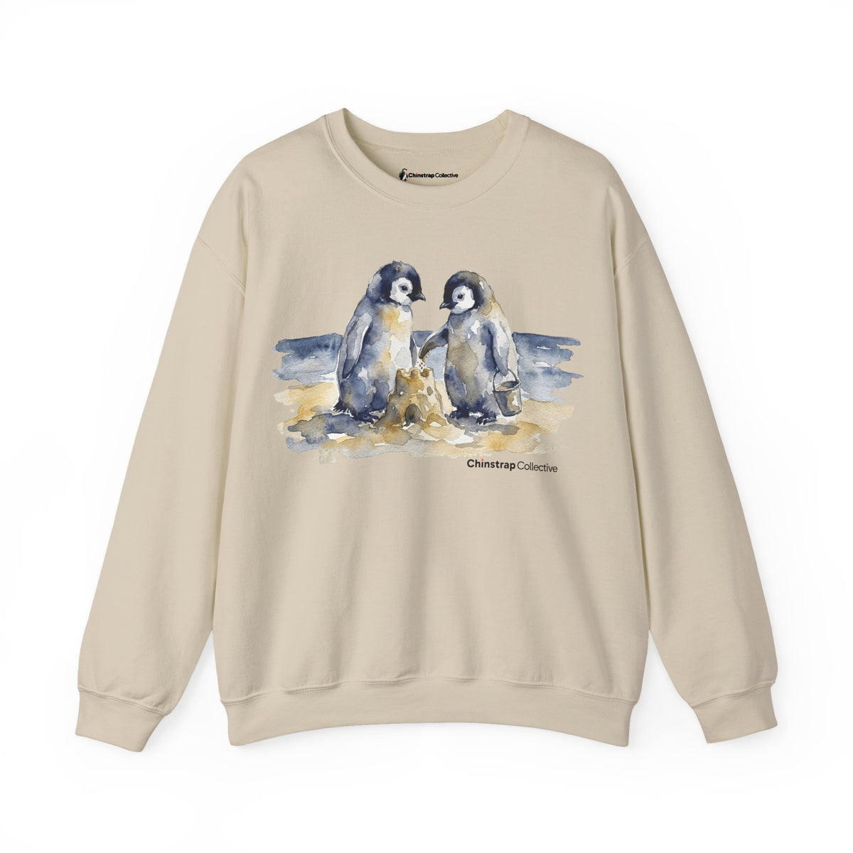 Sandcastle Penguin Chicks penguin sweatshirt in Sand: The front print is a soft watercolor in navy, slate grey and golden…