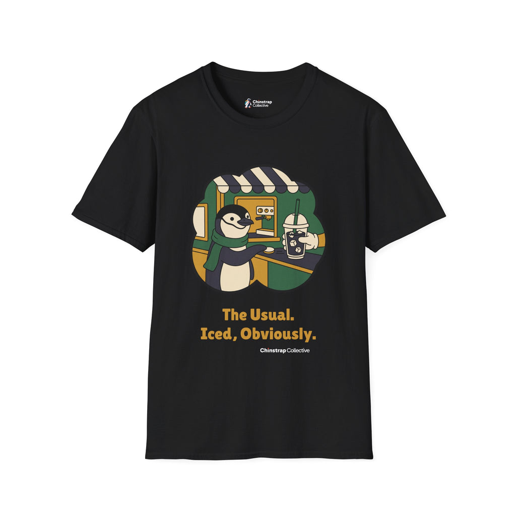The Usual penguin T-shirt in Black: Inside a green and gold sticker-style frame, the penguin in a green scarf slides a…