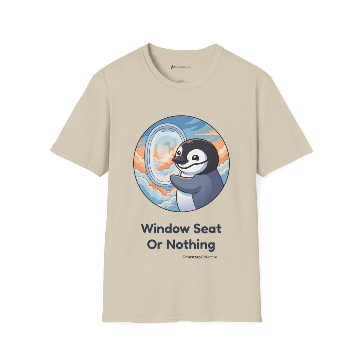 Window Seat penguin T-shirt in Sand: A cartoon chinstrap penguin beside a round airplane window full of peach and blue…