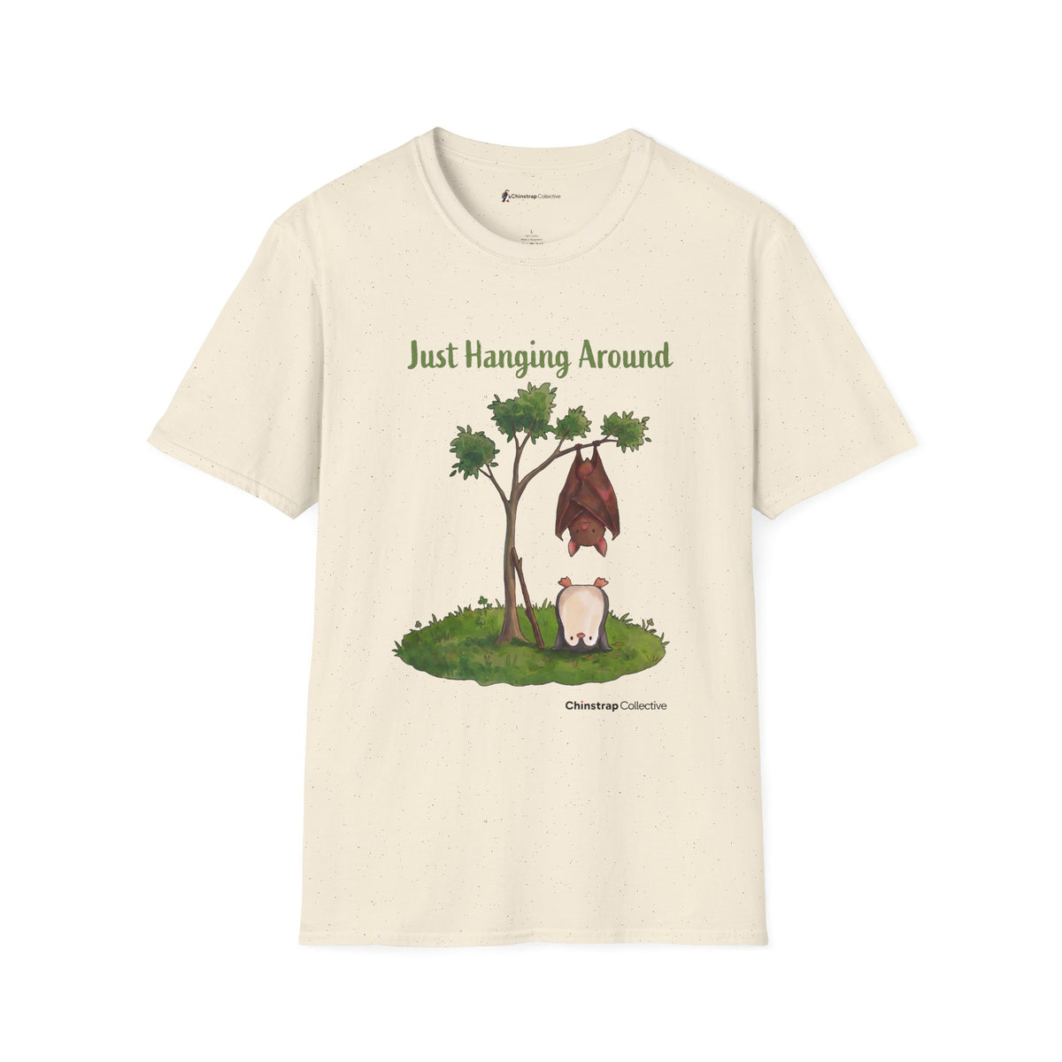 Just Hanging Around penguin T-shirt in Natural: A brown bat hangs upside down from a leafy tree while, on the grass…