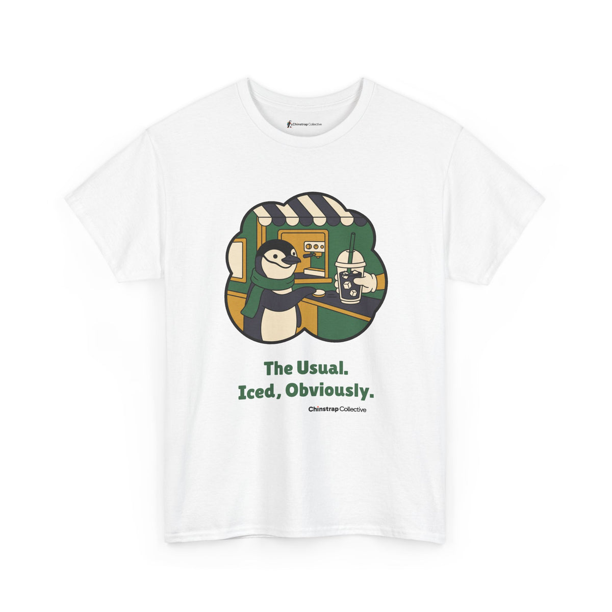 The Usual penguin T-shirt in White: Inside a green and gold sticker-style frame, the penguin in a green scarf slides a…